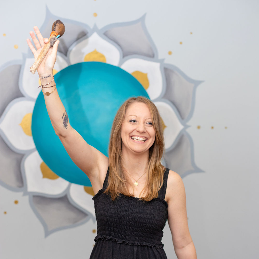 Nicole Beachum of Energetic Pathway Holding a Rattle