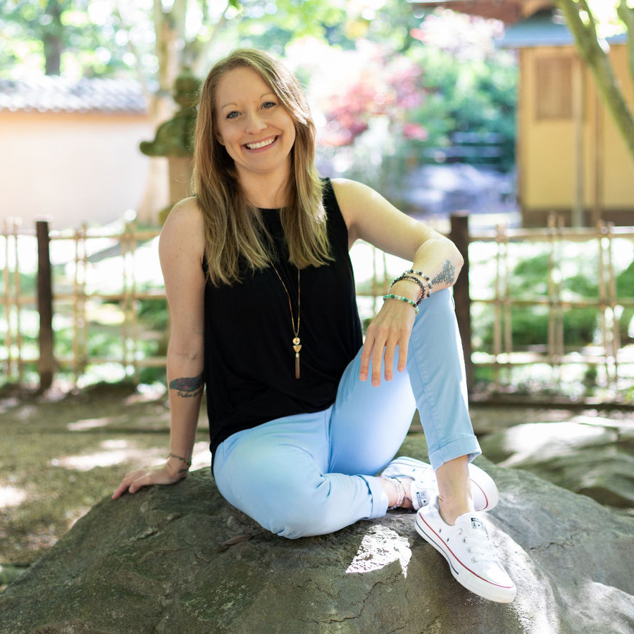 Nicole Beachum of Energetic Pathway sitting on a rock in Birmingham, Alabama